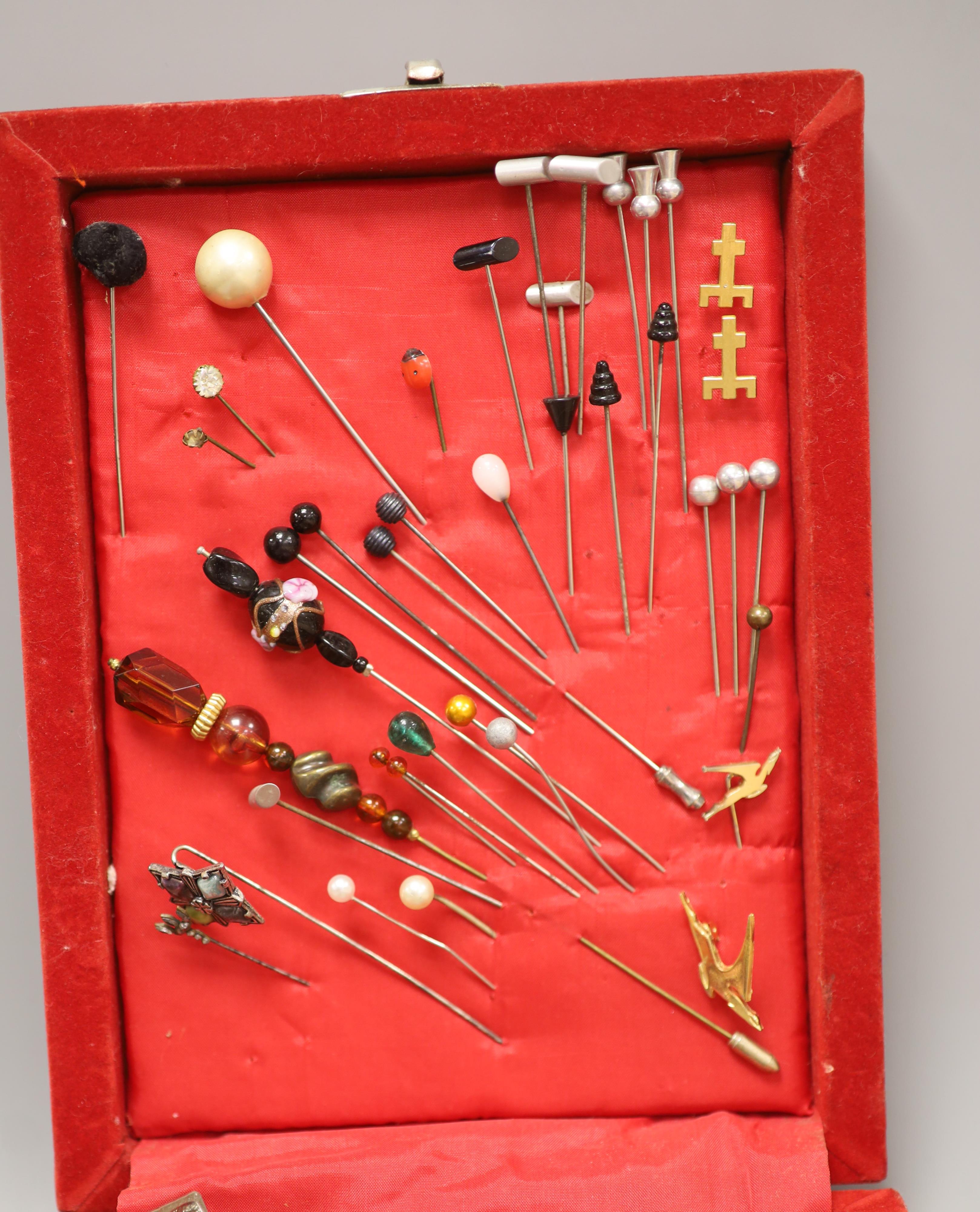 A mixed quantity of costume jewellery including stick pins, Scottish hardstone brooch, silver medallion, etc.